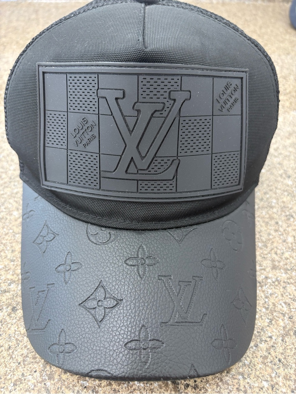 Black Embossed Monogram Patch Cap with Black logo of Louis Vuitton